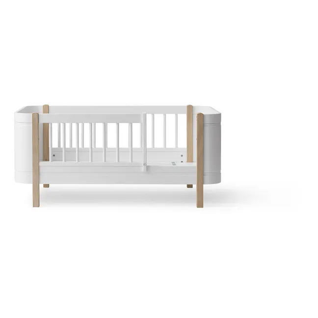Wood Mini+ cot bed uncluding junior kit | Oak