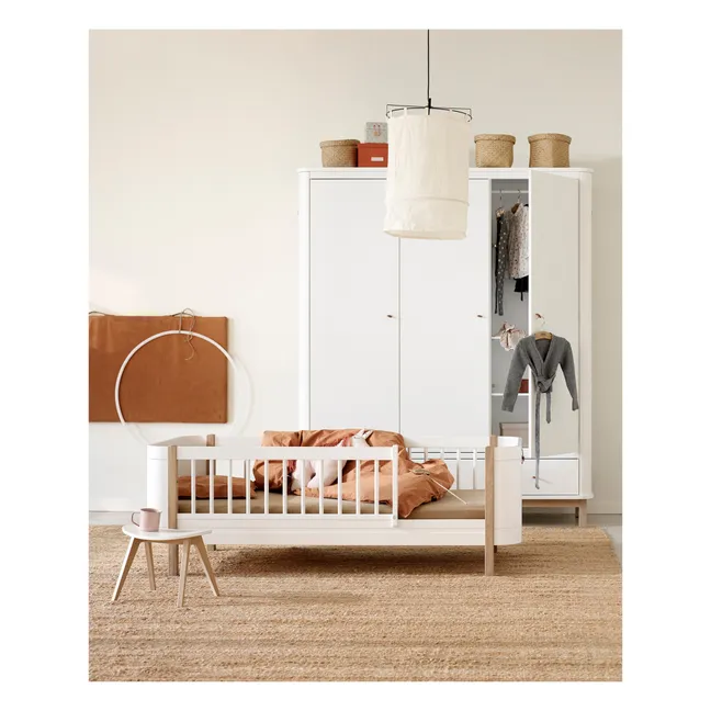 Wood Mini+ cot bed uncluding junior kit | Oak