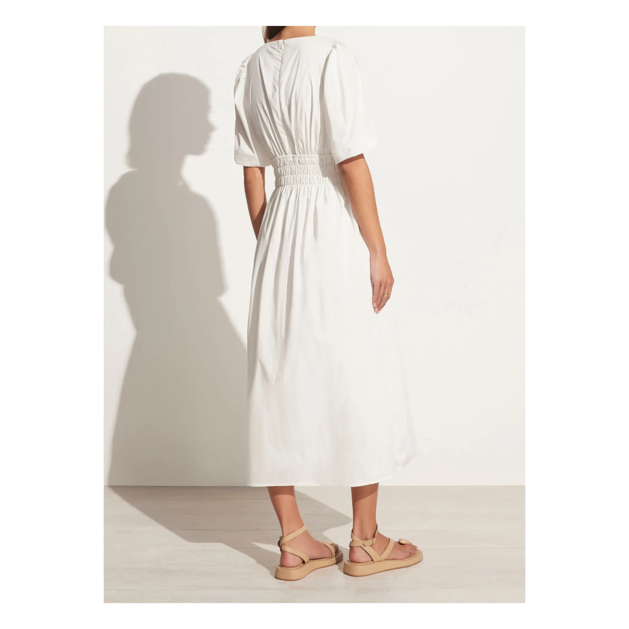 agnata midi dress MEET VALENTINA A refined composition of form and craft; cut from a breathable linen-cotton blend, shaped through the bodice and releasing into a full midi-length skirt with quiet volume. At the sleeve,
