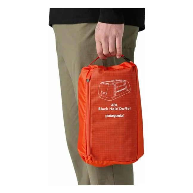 Black Hole Duffel 40L Recycled Fiber Backpack | Orange