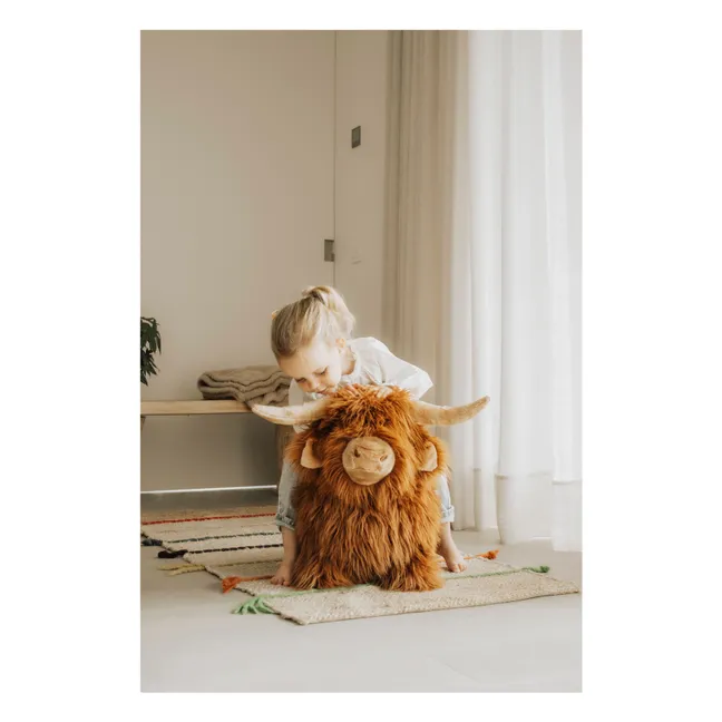 Mucca highland che rimbalza | Marrone