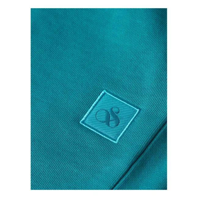 Pantalones cortos de algodón orgánico Logo Badge Jogger | Azul Laguna